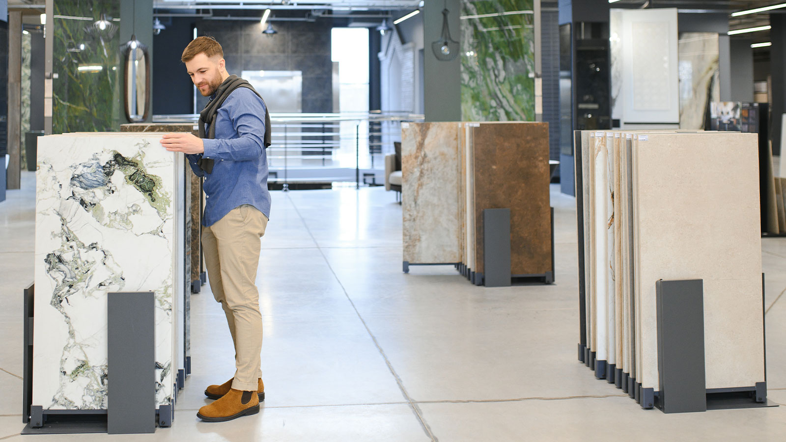 Large warehouse displaying marble and granite slabs at a natural stone supplier in Dubai.